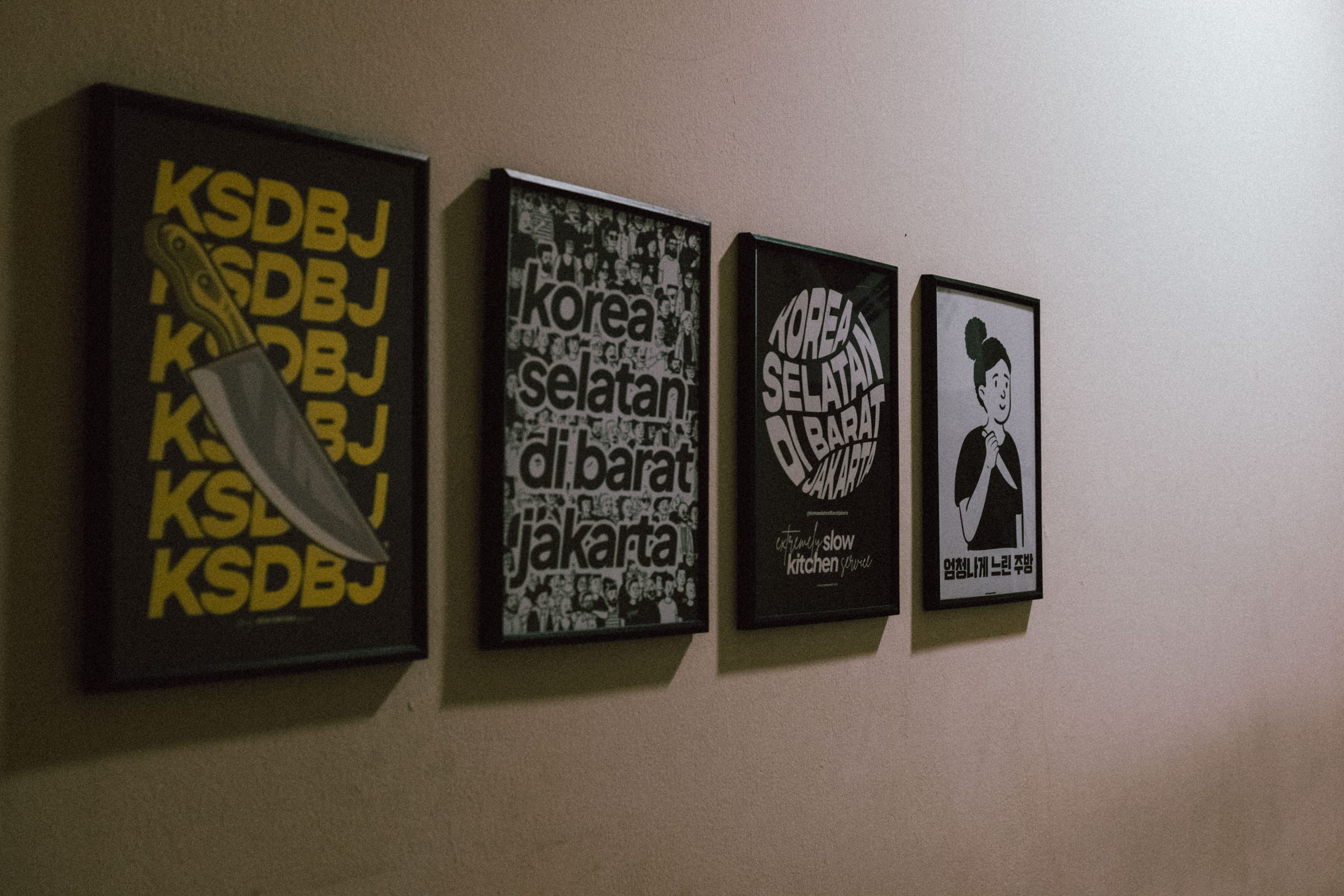 Korea Selatan Di Barat Jakarta posters displayed along the wall at home.
